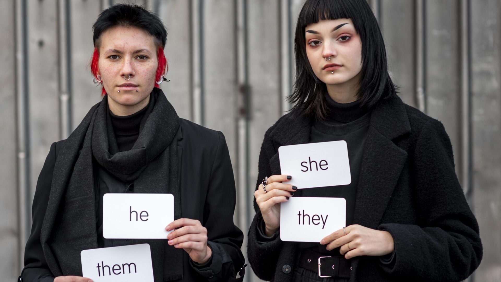 front-view-non-binary-people-holding-pronouns-cards